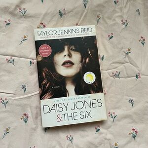 Daisy Jones & The Six  paperback book by Taylor Jenkins Reid